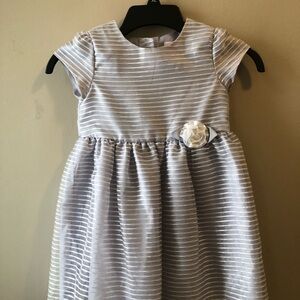 Elegant Striped Dress with Floral Accent